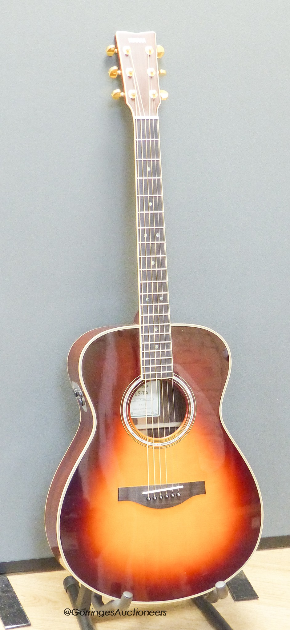 A Yamaha LSTA Tran Acoustic guitar, sunburst with Yamaha soft case